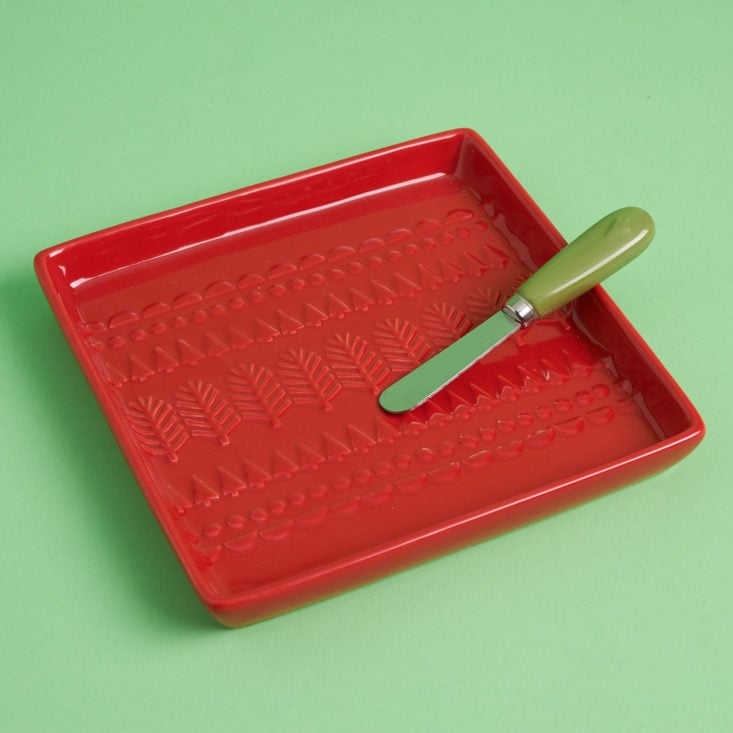 red serving dish and spreader