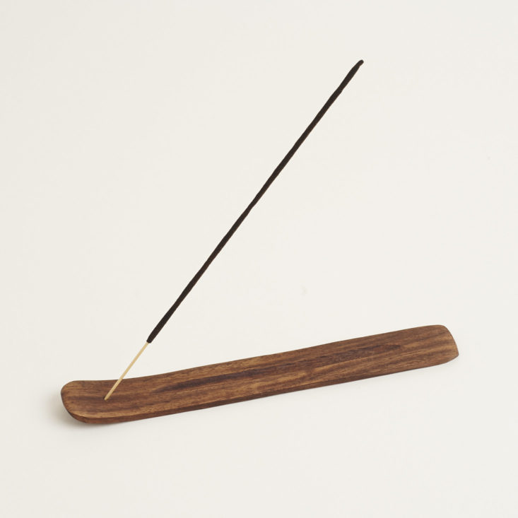 incense stick in the wooden holder