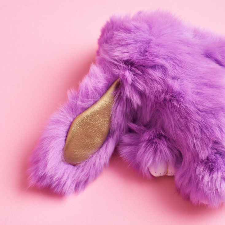 purple bunny plush keychain with a golden ear