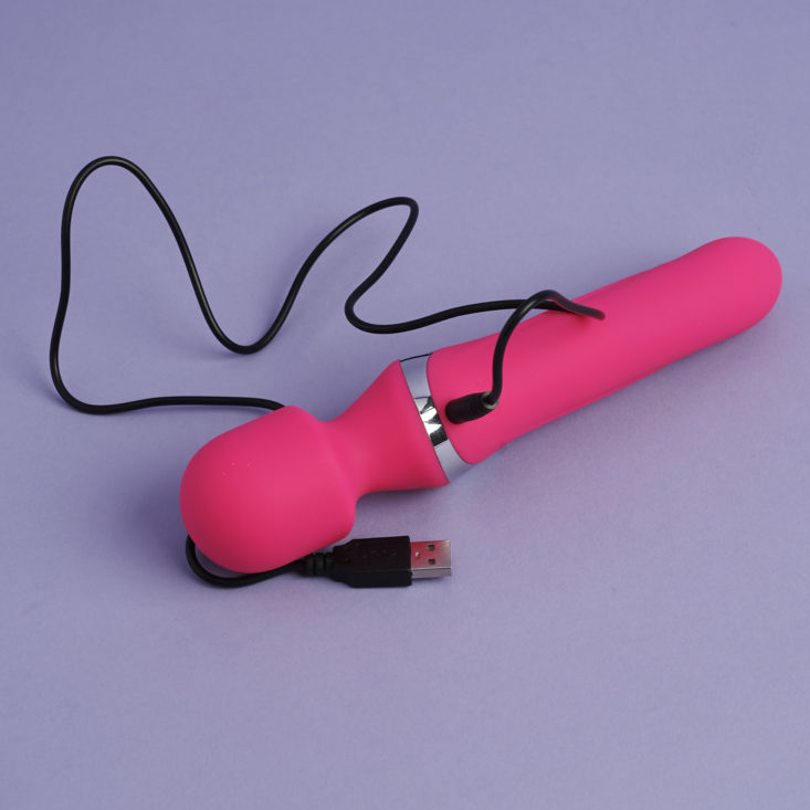 pink Aphojoy Angel personal massager with charging cord plugged in