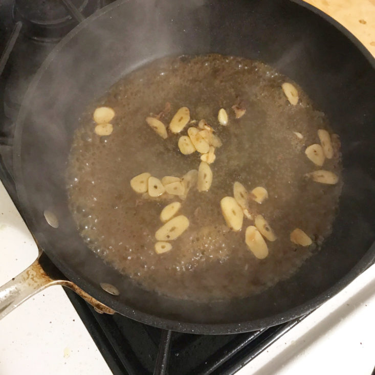 garlic and water cooking in pan