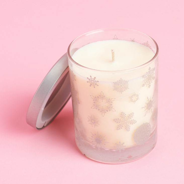 minty candle with snowflake patterned votive