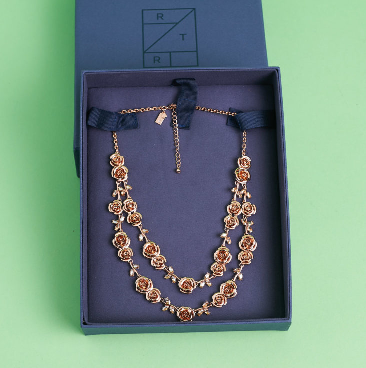 rose necklace in jewelry box from rent the runway