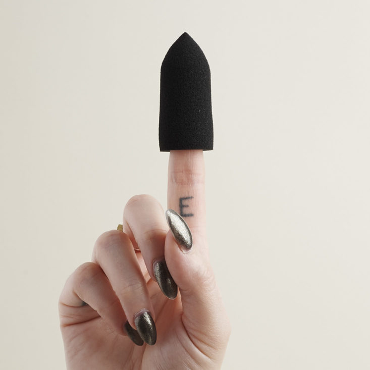 The Makeup Bullet on finger