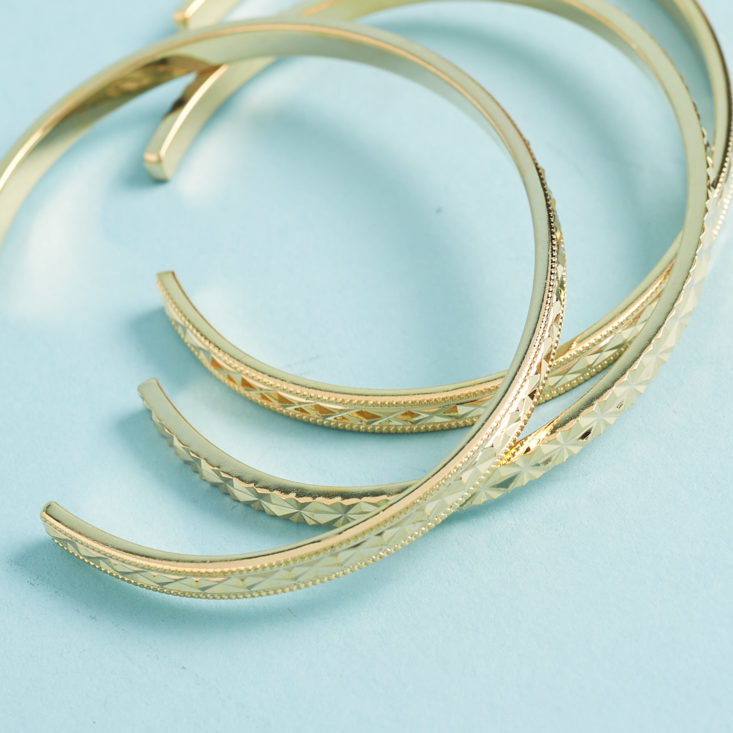 texture of gold bangle-like cuff bracelets