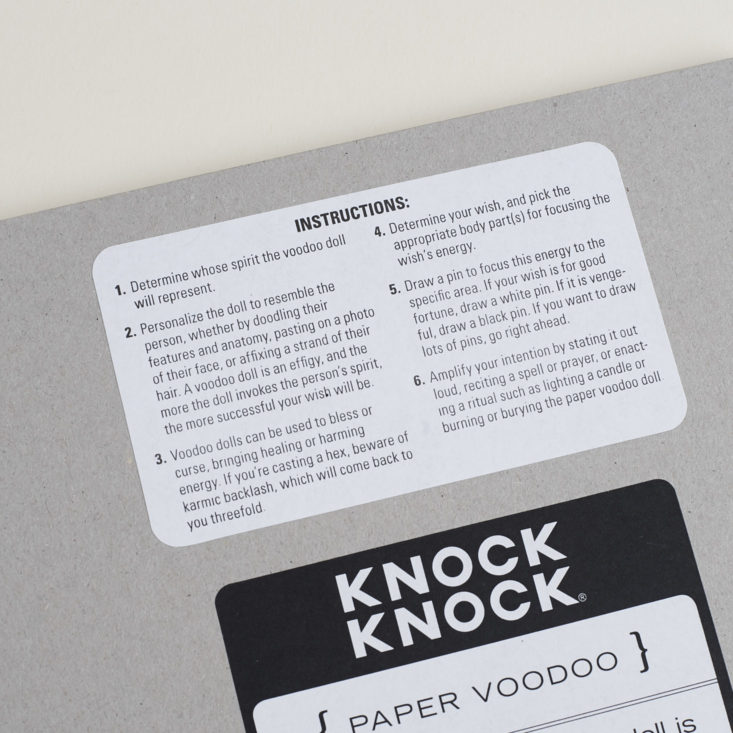 close up of back of knock knock paper voodoo notepad