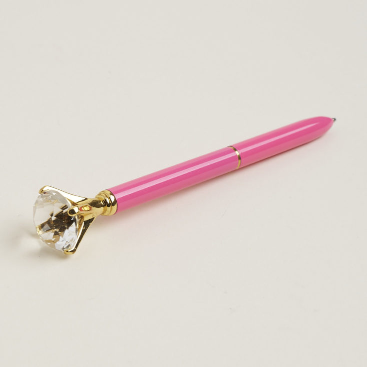 close up of pink diamond-topped pen