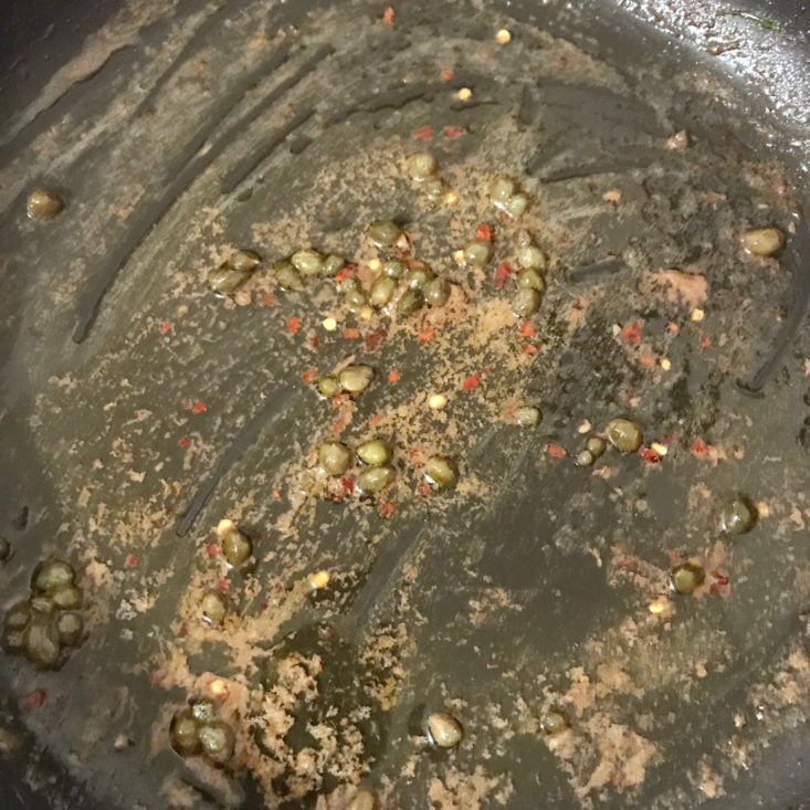butter, redn pepper flakes, and capers cooking in pan