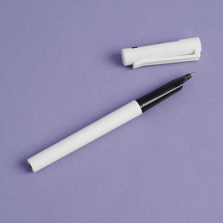 0.5mm black ink gel pen in white with lid off