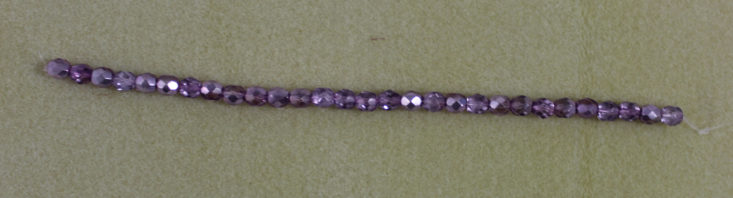 firepolished purple beads on a string