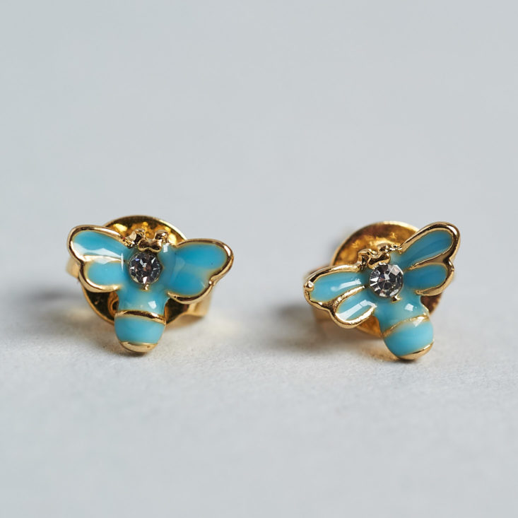 two tiny butterfly earrings close up 