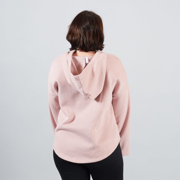 back of pink hoodie on model