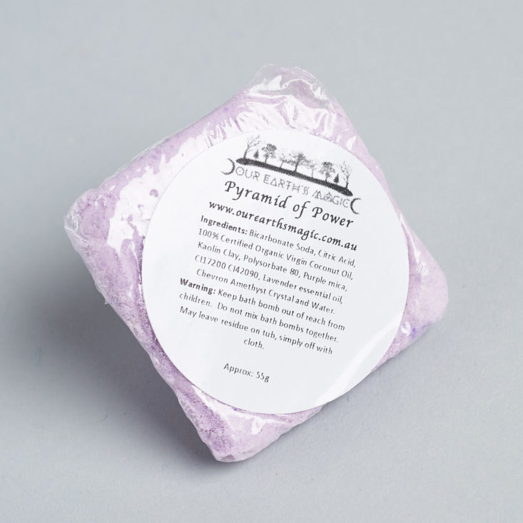 bottom label of a purple pyramid shaped bath bomb