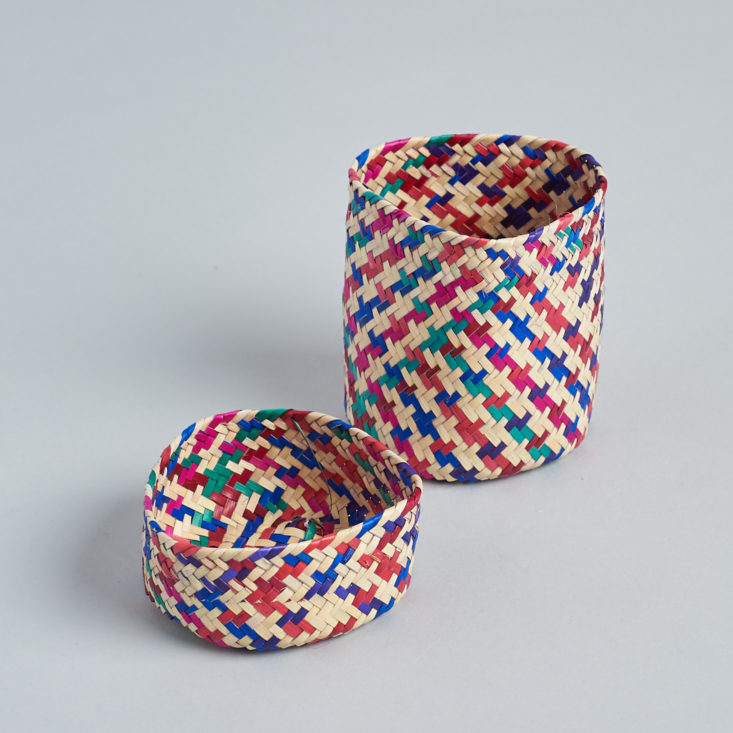 A red and blue woven basket without its lid.