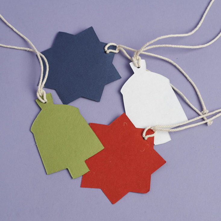 back of set of four patterned colorful gift tags