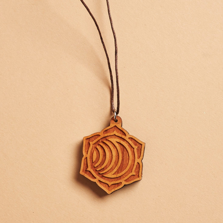 wooden pendant on a long cord 