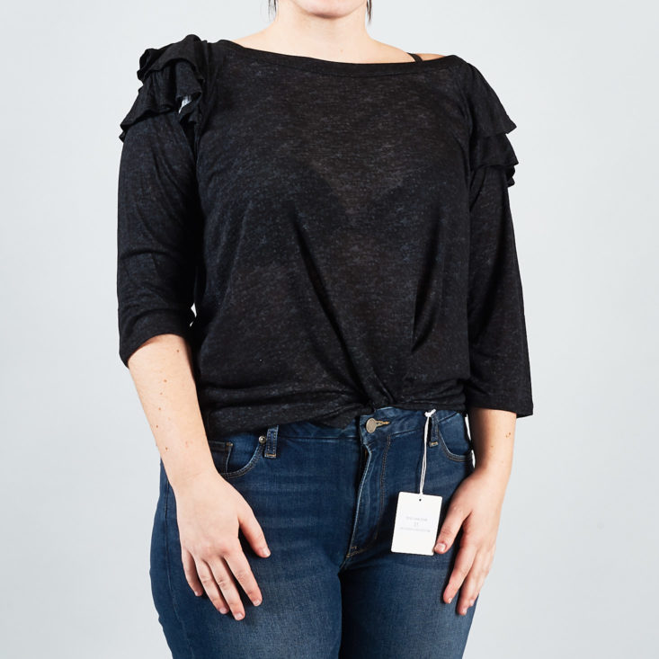 This ruffle-shouldered top looks super cute tucked into jeans