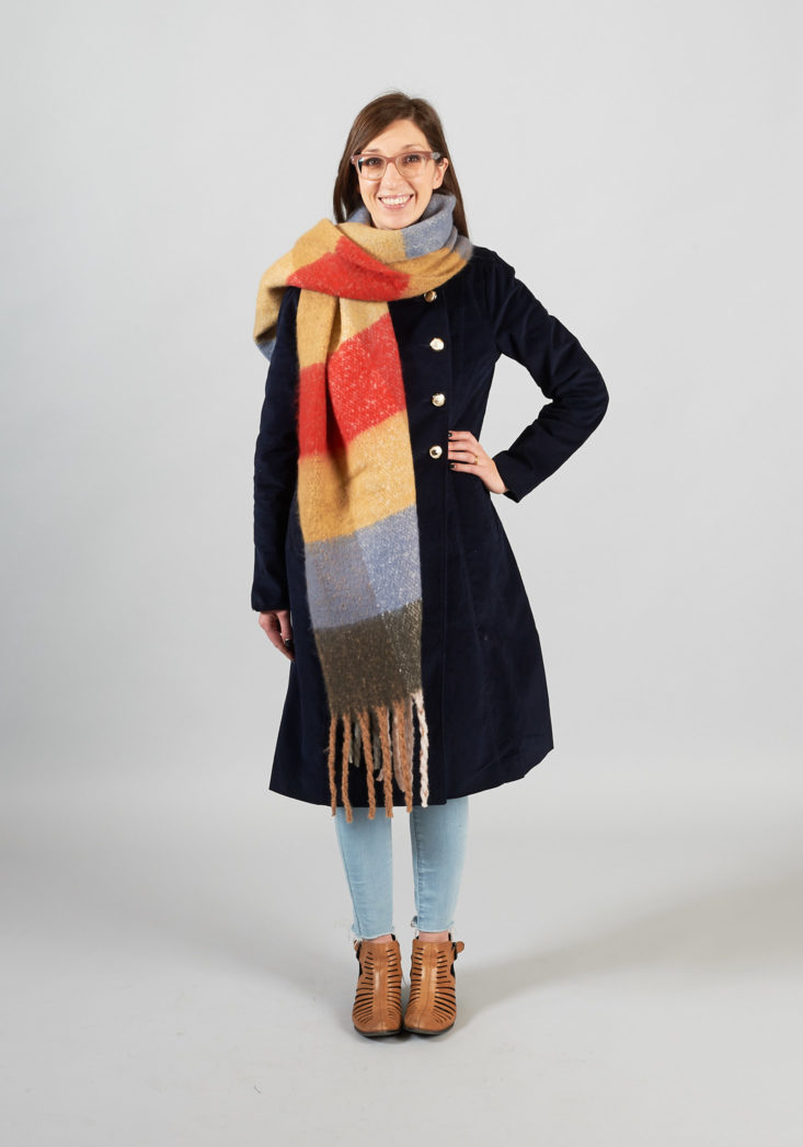 Navy Blue Peacoat layered with plaid scarf on model