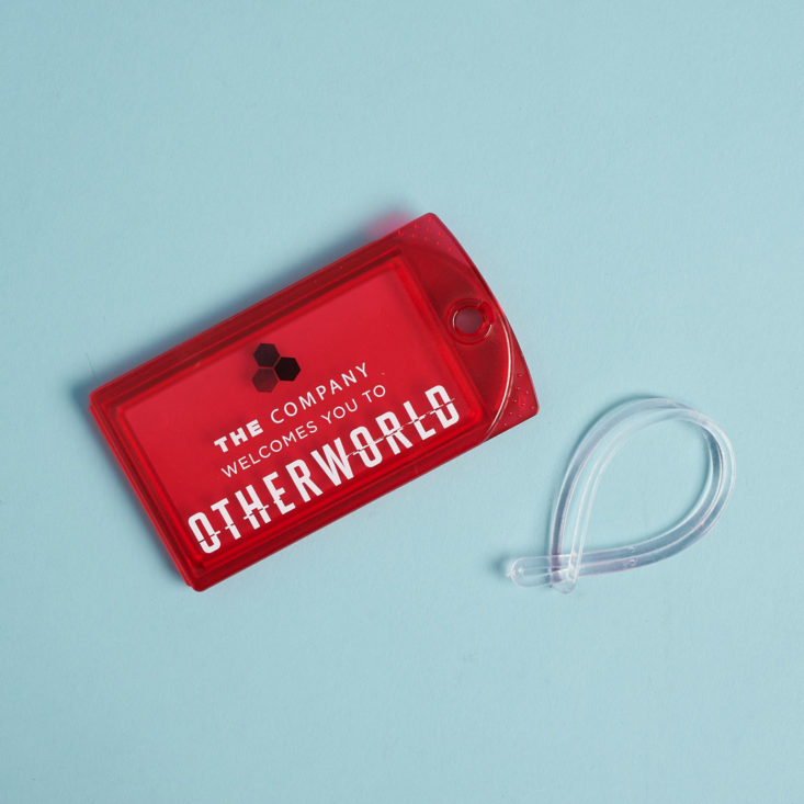 otherworld luggage tag in red