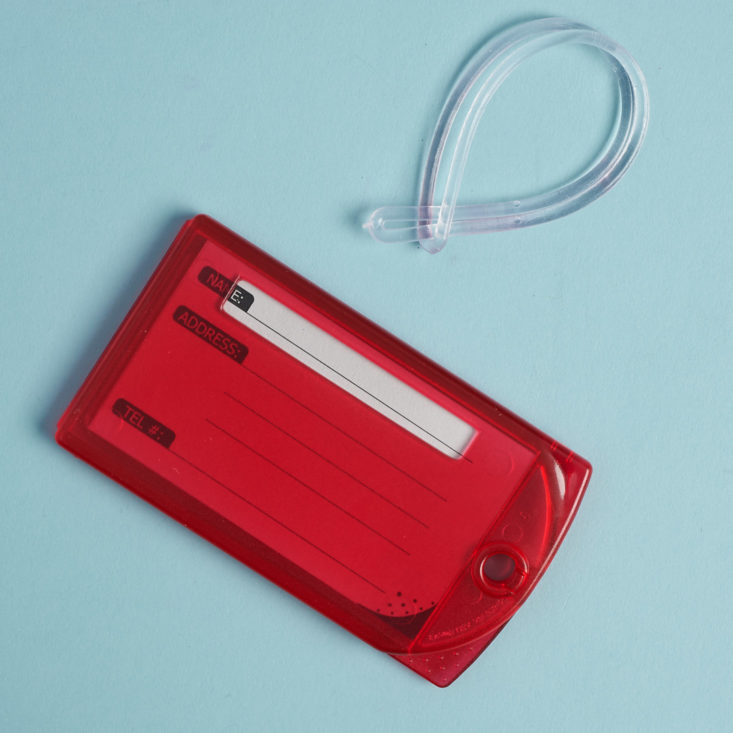 red luggage tag with plastic loop connector