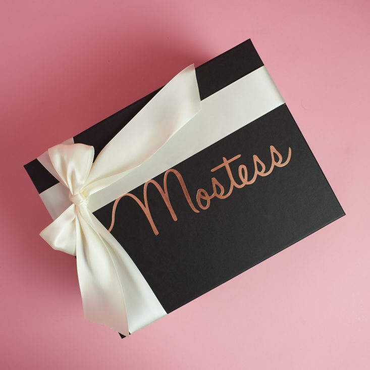 Mostess boxes come wrapped in a hand-tied white ribbon