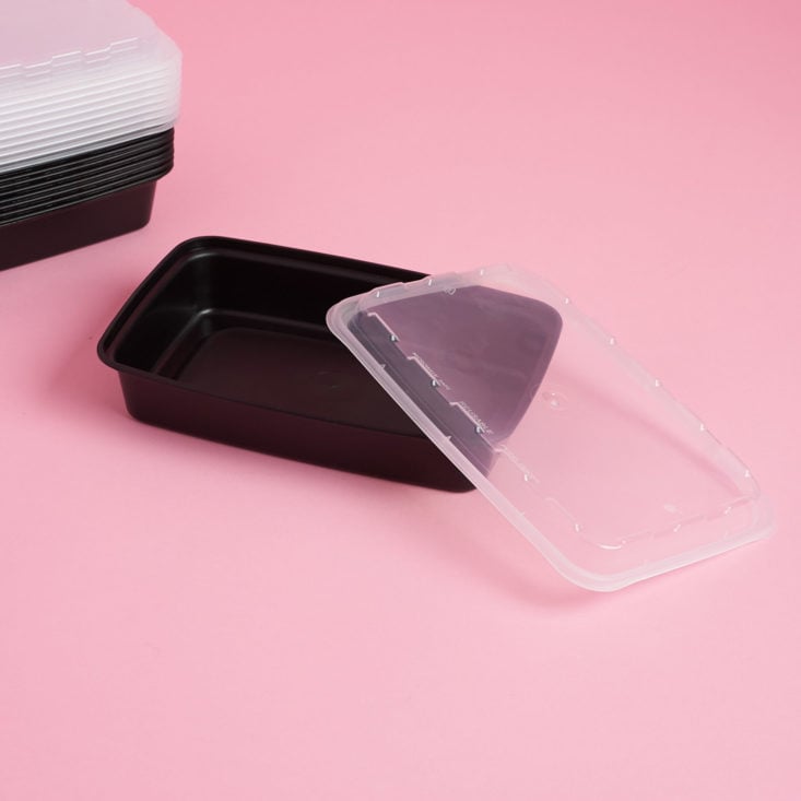 a black plastic food container with a clear lid 