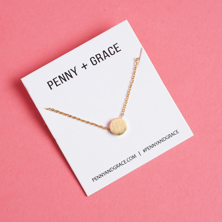 Penny + Grace necklace on the backing