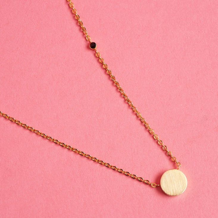 This simple circle charm necklace can go with anything