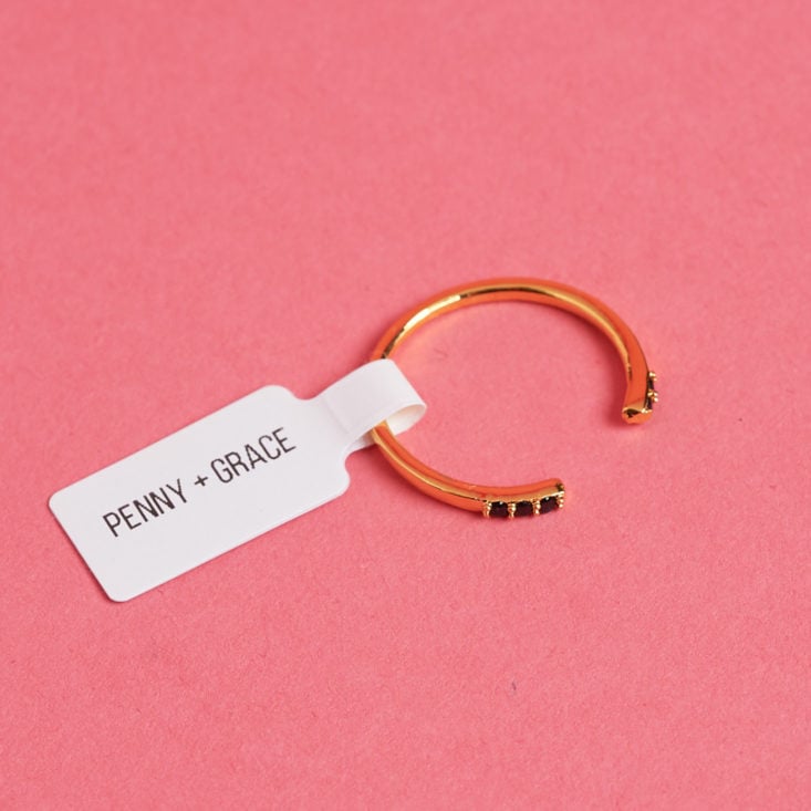 Gem studded gold cuff-style ring from Penny + Grace