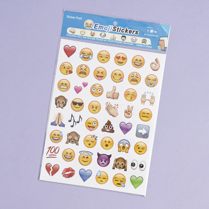 4 sheets of emoji-shaped stickers in their packaging