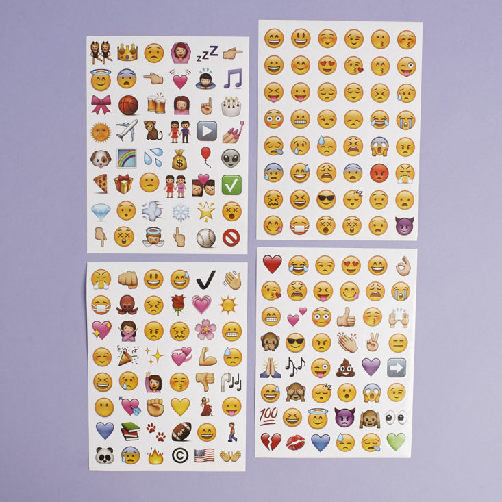 four sheets of emoji-shaped stickers laid out flat