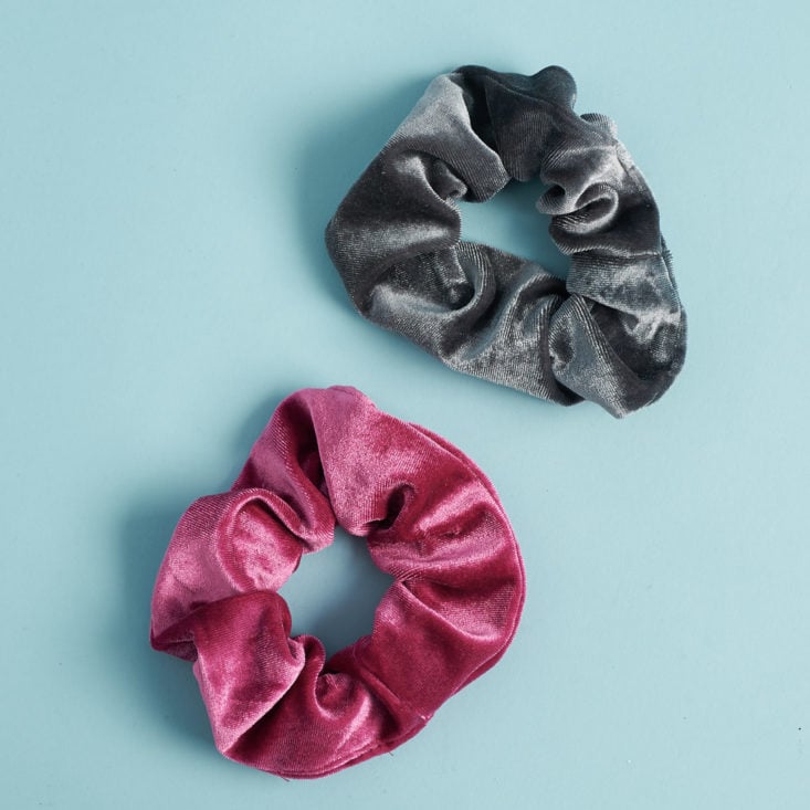 one maroon velvet scrunchie and one gray velvet scrunchie