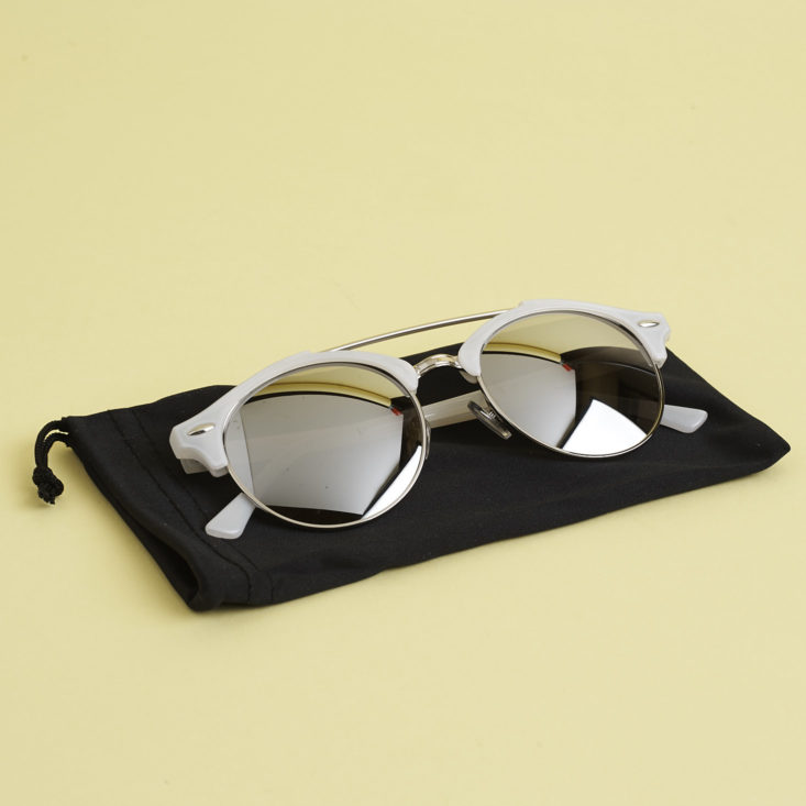 White and silver round browline mirrored sunglasses on black pouch