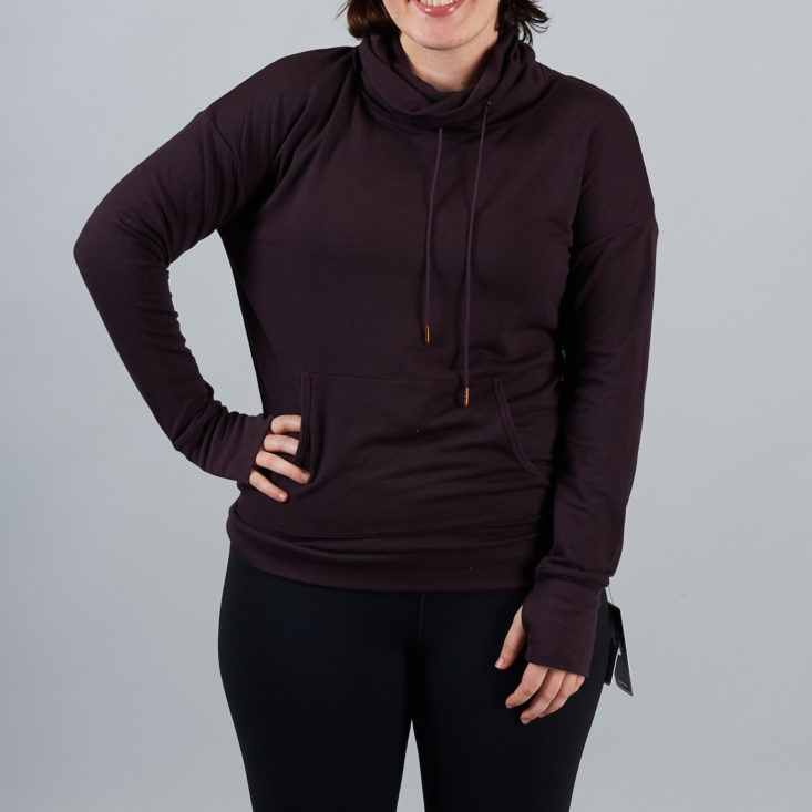Burgundy pullover hoodie with thumbholes on a woman
