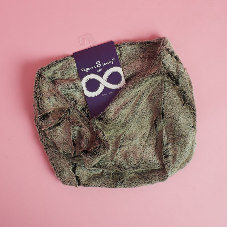 brownish furry circle scarf in package from other angle