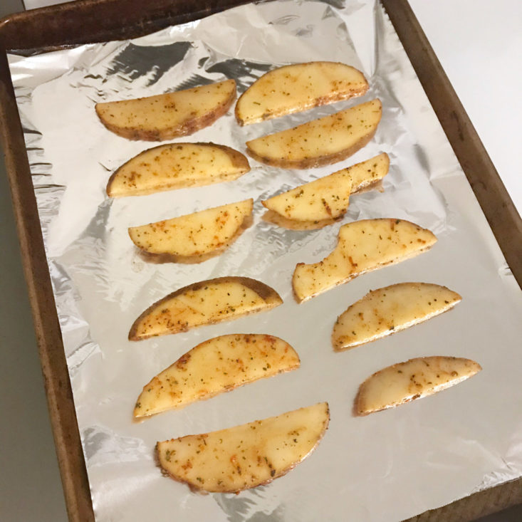 potatoes wedges on baking sheet