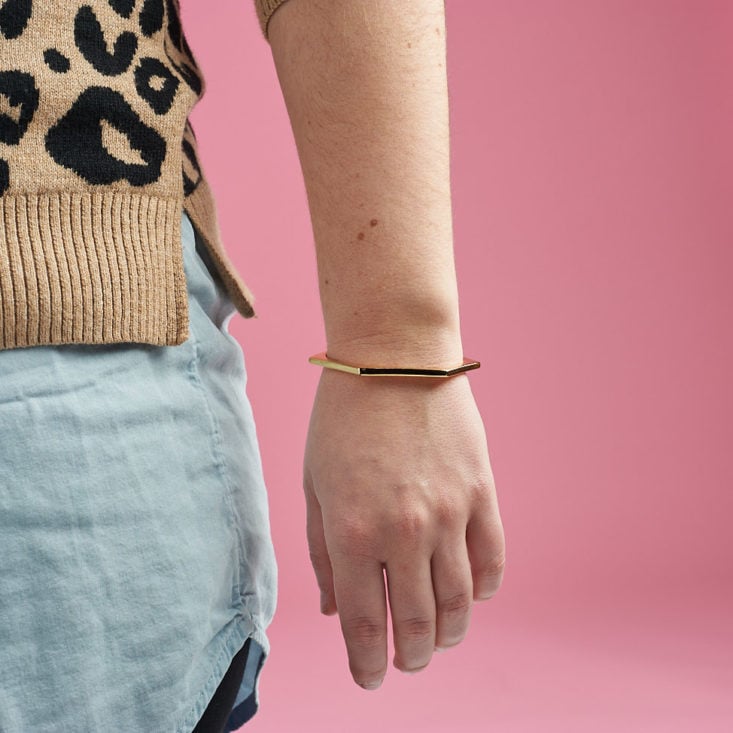 gold bangle on hand