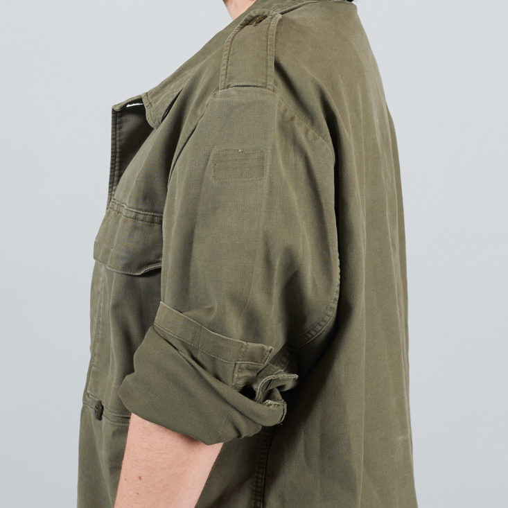 shoulder and sleeve of olive jacket