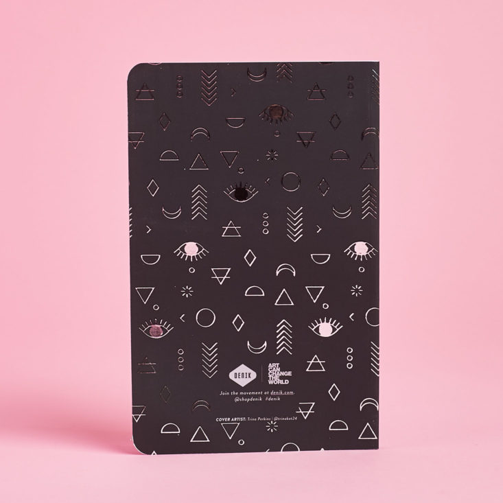 black notebook with silver symbols