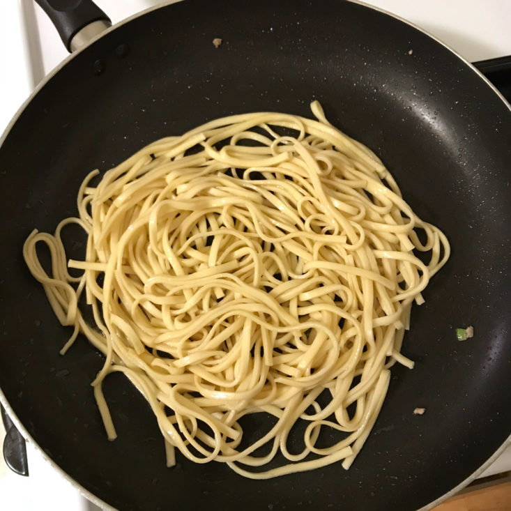 cooked noodles in frying pan
