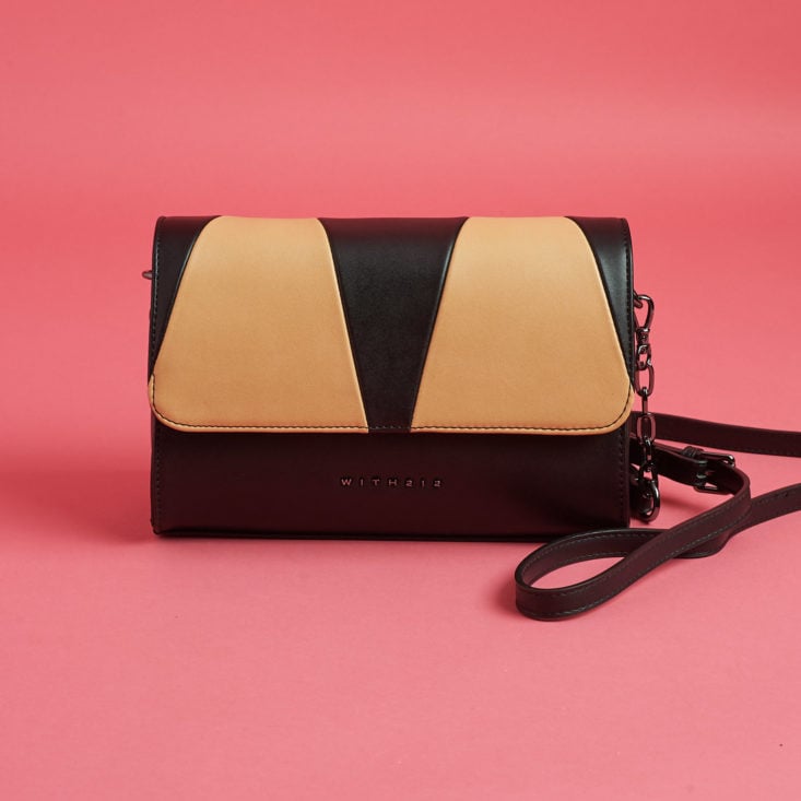 black and tan handbag with minimalist details