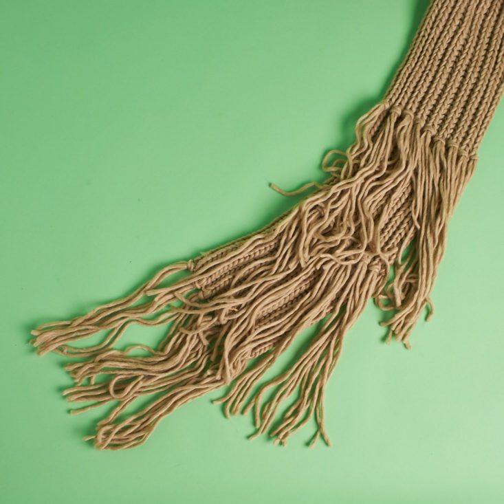 tassels on tan scarf