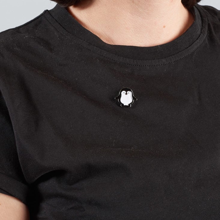 penguin pin on black shirt