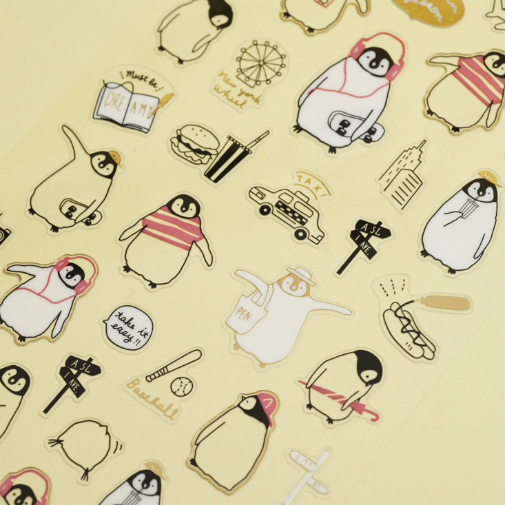 close up of penguin stickers with gold leaf
