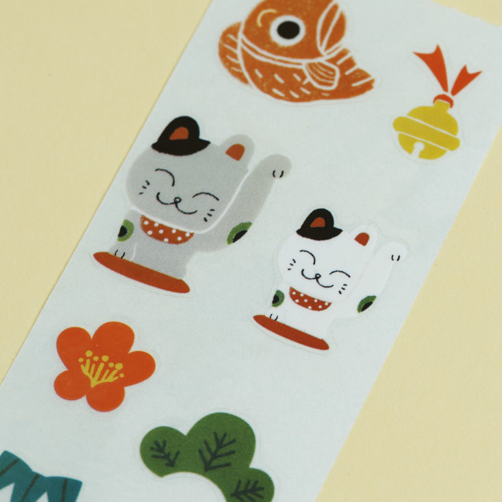 close up of shinzi katoh and seal do lucky symbols stickers