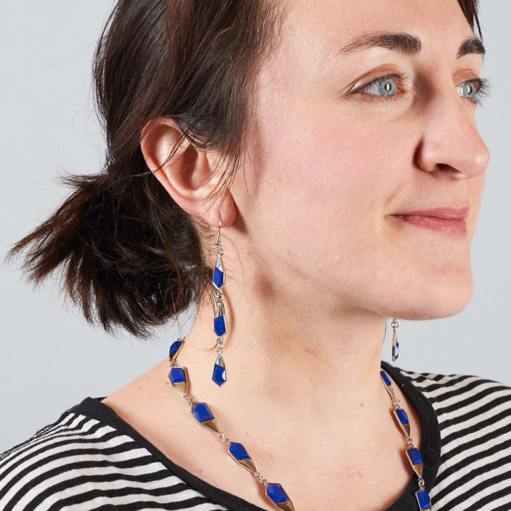 blue fragment earrings on woman