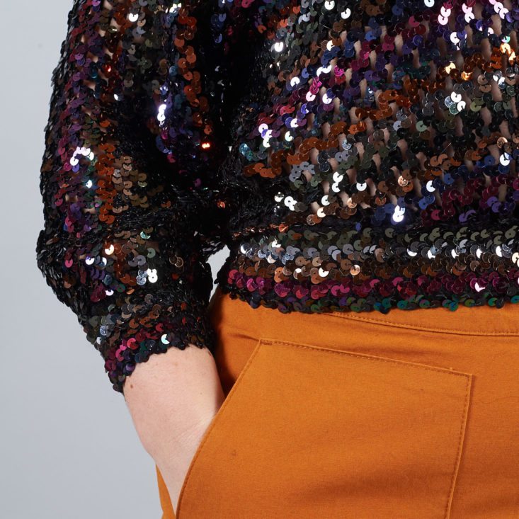 waistband detail of sequin sweater