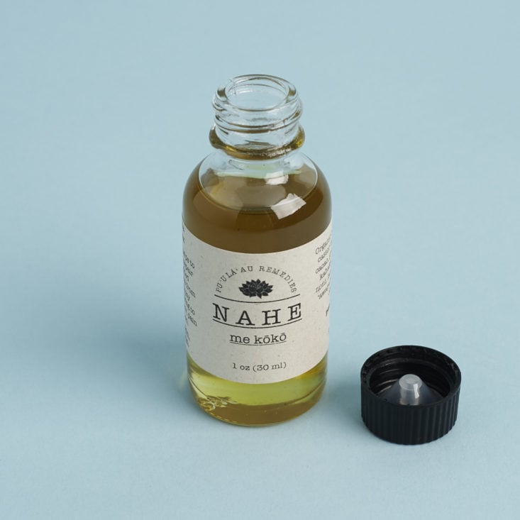 Pu ula au Remedies Nahe Lomi Massage Oil with cap off