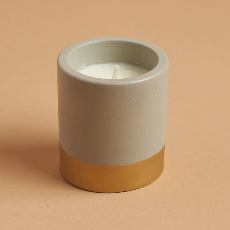 Matching concrete and gold candle