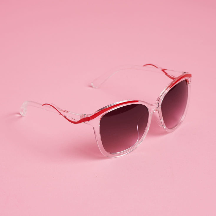 clear sunglasses with red details